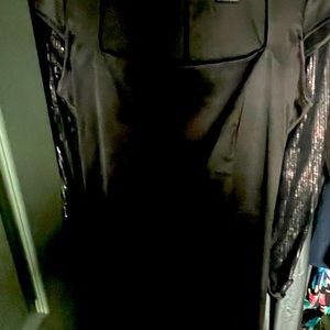 Black satin, box neck, just  below the knee dress